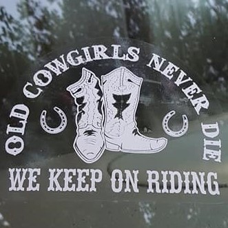 A window sticker with cowboy boots and the words " old cowgirls never die we keep on riding ".
